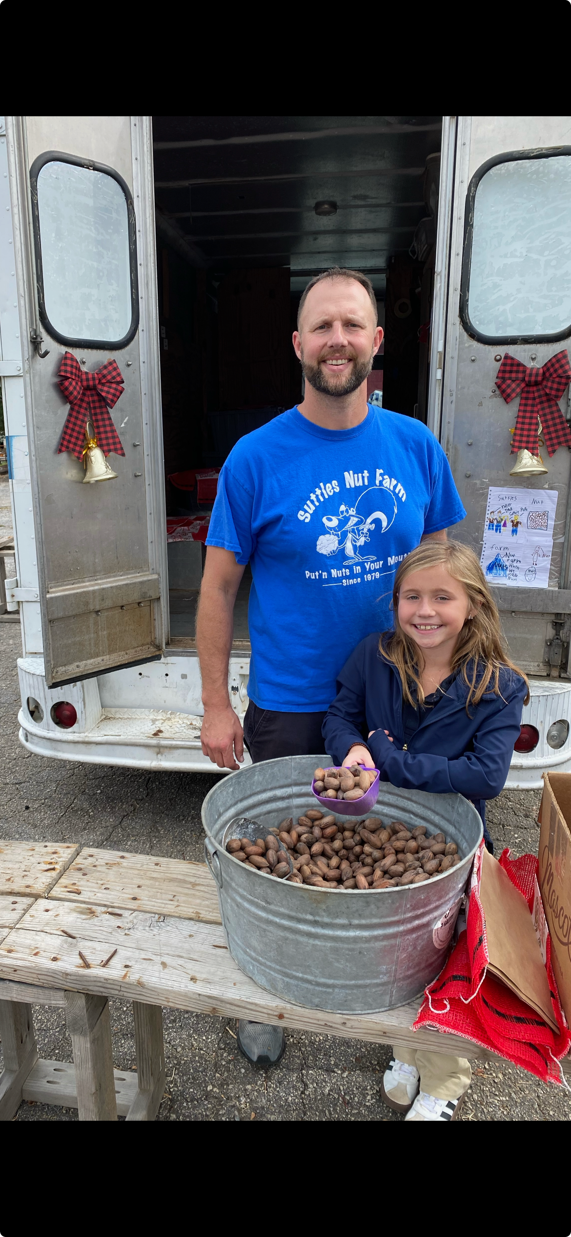 Home Tracy Suttles' son and granddaughter together at the family pecan truck.